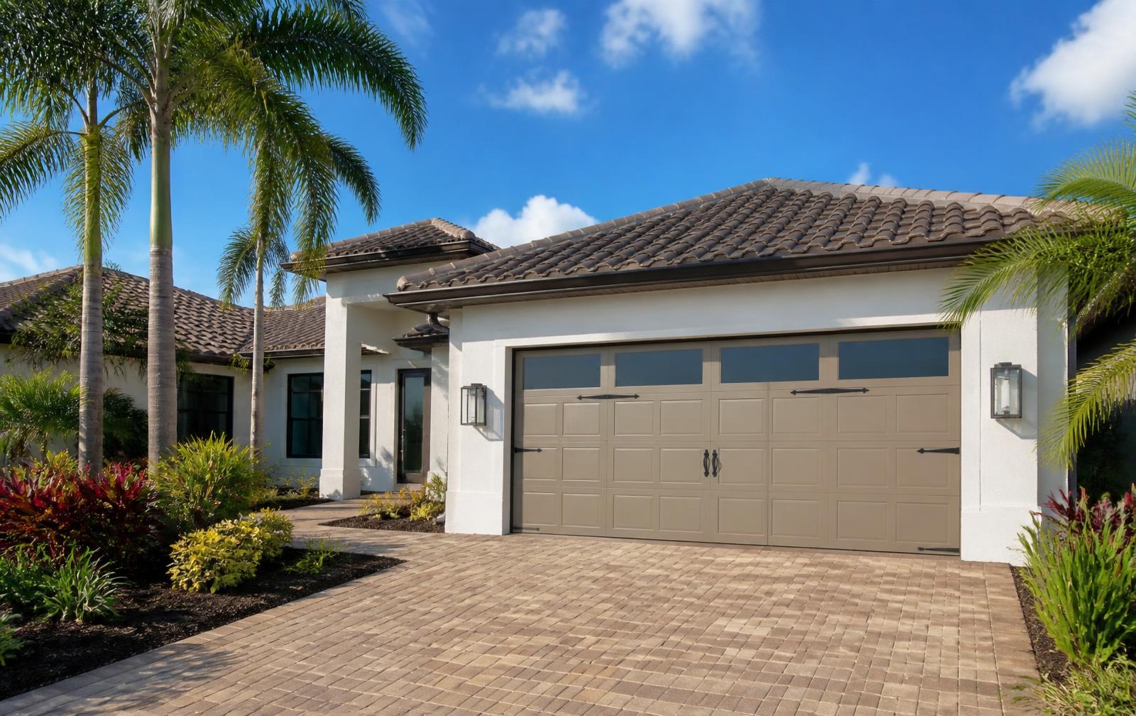 New hurricane-rated garage door installed on a palm-lined Fort Myers, Florida home